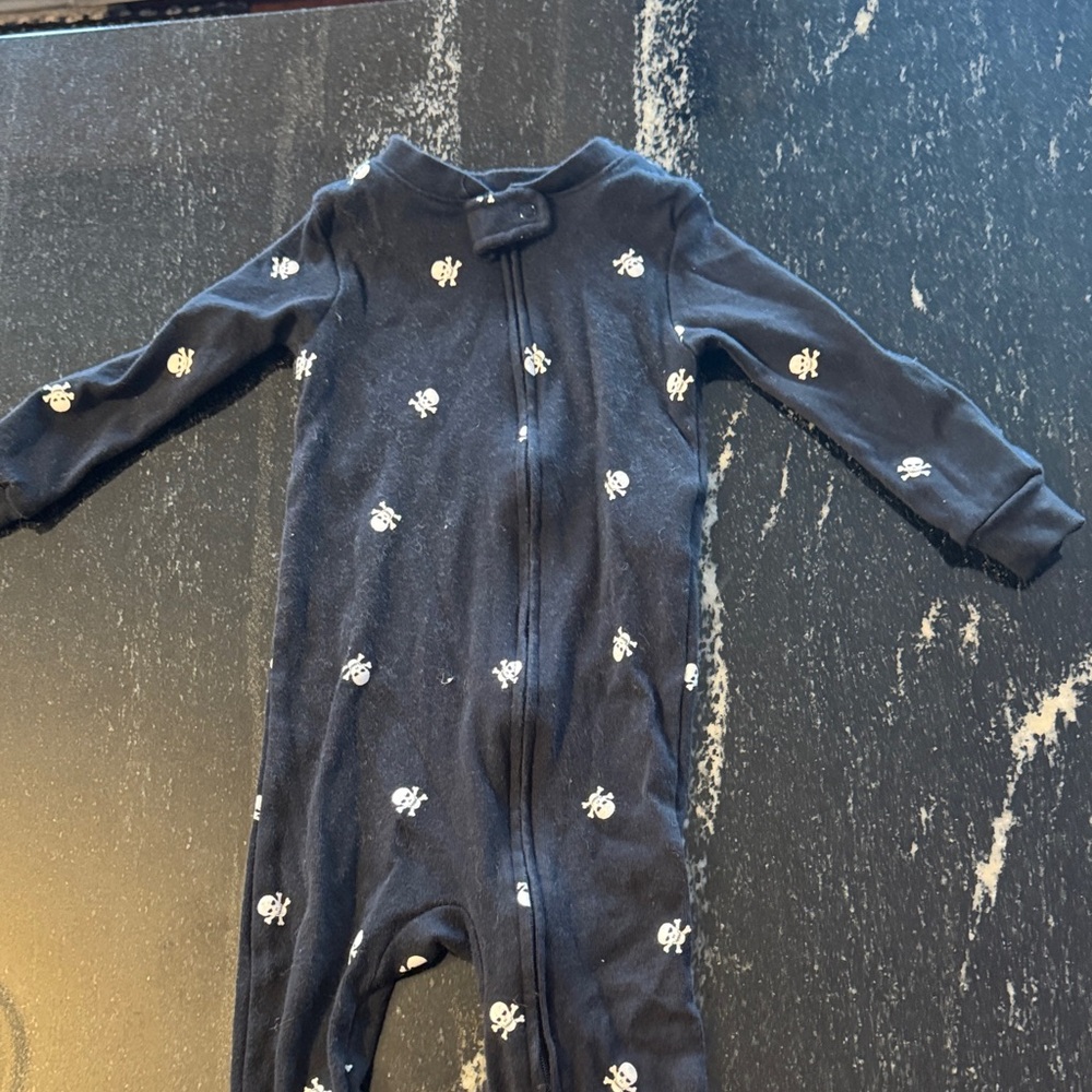 Amazon Essentials black and white Kids Footed Pajamas with White Skull Design